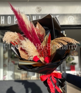 Stunning dried floral bouquet including pampas, spear palms and forever roses. 