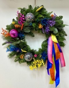 Merry & bright rainbow door wreath bursting with bold and beautiful colour. Including dried florals, confetti baubles and trail's or mixed coloured ribbon. 