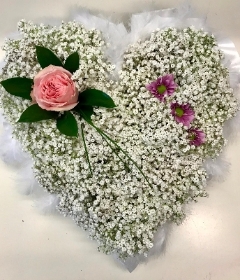 Gypsophila heart with ribbon edge and pink focal flowers. 
