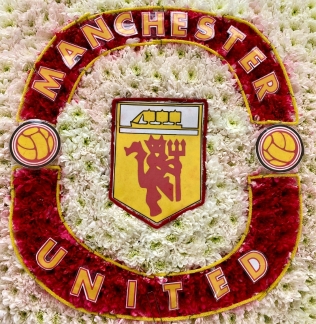 Manchester United funeral tribute, created using chrysanthemum and carnations.