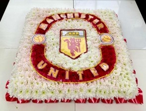 Manchester United funeral tribute, created using chrysanthemum and carnations.