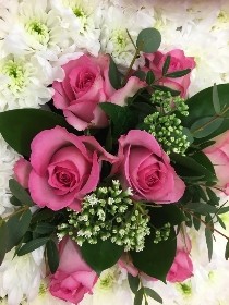 Teapot funeral tribute with delicate lilac and soft pink focal flowers. 