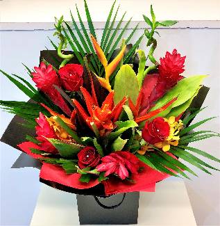 Beautiful tropical mix including heliconia, ginger and orchids wrapped in cellophane and signature gift bag.
