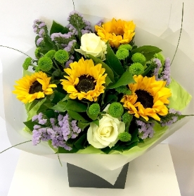 Hand tied of white, lilac and greens flowers, finished with stunning sunflowers. 