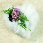 Heart shape design made with soft white feathers and lilac focal. 