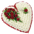 Massed heart with beautiful red rose focal. 