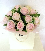 Luxury hand tied of 12 soft pink sweet avalanche roses. 