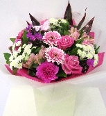 Hand tied of pink roses, germini and carnations finished with glitter and diamanté's.