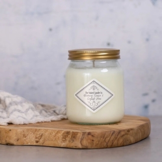 The Naked Candle Co Blooming Freesia & English Pear soy candle with fruity top notes and freesia heart.