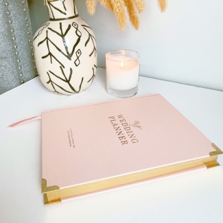 Blush & Gold Blush wedding planner with soft blush pink cover and gold detailing.