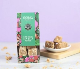 Caramel sea salt fudge, presented in a vibrant floral patterned treat bag. 