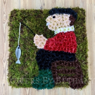 Fishing funeral tribute created with moss and chrysanthemum on a 24 x 24 inch design board. 