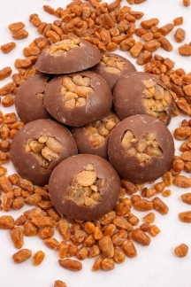 Cambridge Confectionery Company large milk chocolate buttons with toffee and sea salt – 130g bag stocked by Flowers by Bethany.