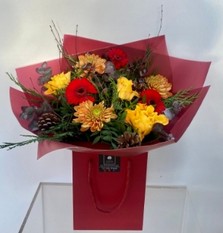 Gift bouquet including Roses, Germini, Pine Cones, Blooms, Birch & Eucalyptus in rich orange & red tones. 