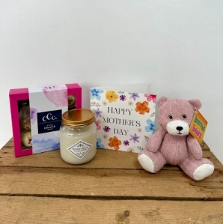 Love Mam Bundle Includes - 1 x 9 Piece chocolate gift box, 1 x Knitted teddy bear, 1 x Bespoke Mother's day card and 1 x Luxury Candle. 