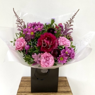 Bouquet filled with rich pink and purple toned florals including peonie, rose, astilbe and carnation. Hand tied in water, presented in our signature gift bag and wrap. 