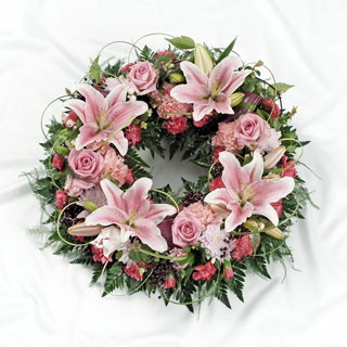 Pink wreath with lily, rose and carnation. 